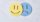 Sad face covered by happy face. Depression and sadness disorder concept.
